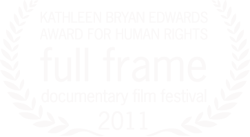 Laurel wreath surrounding text that reads: "Center for Documentary Studies Filmmaker Award, Full Frame Documentary Film Festival 2011." Black background.